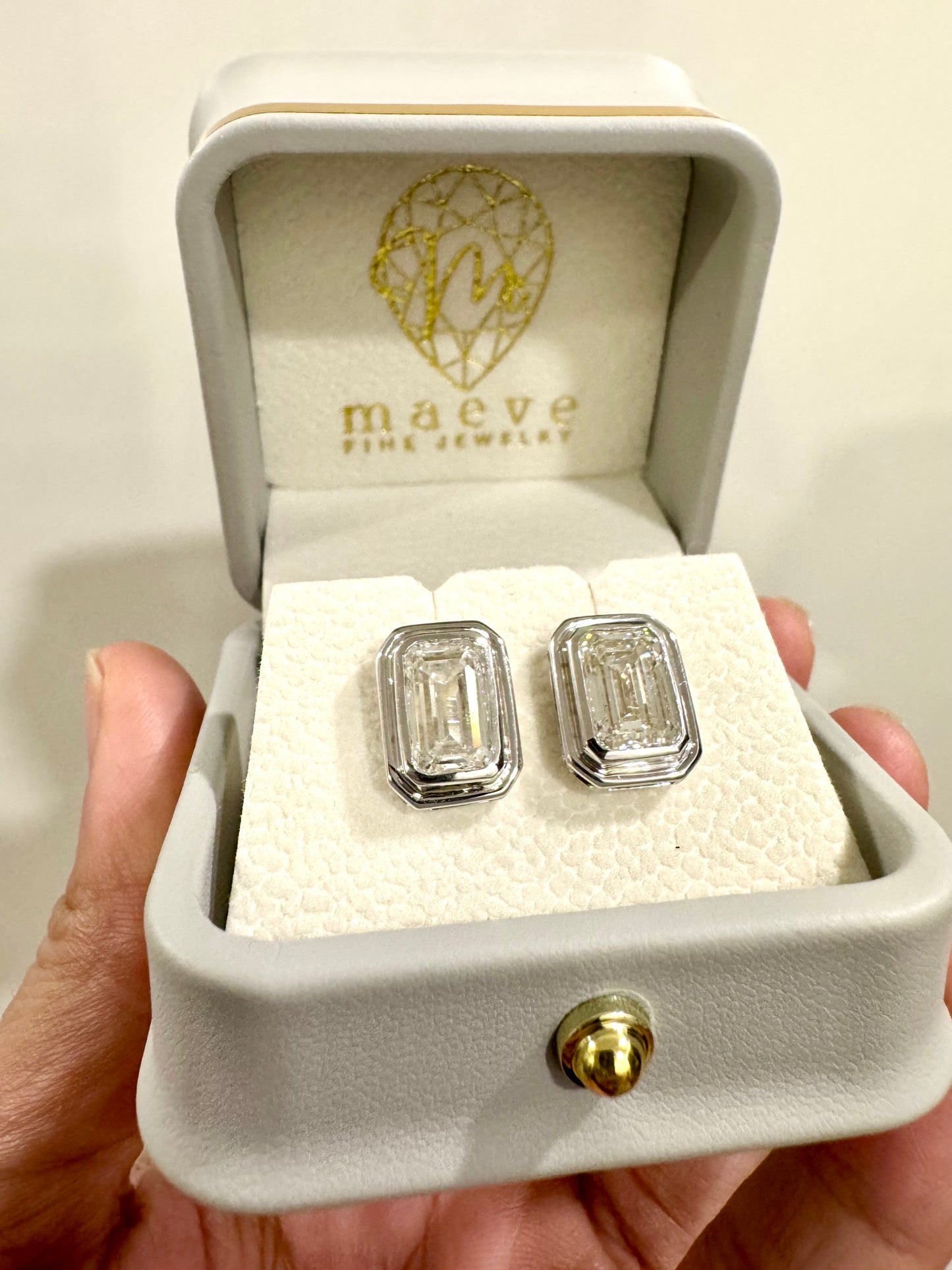Maeve Atelier: 3 + 3 carats Emerald Cut Bezel Set Studs